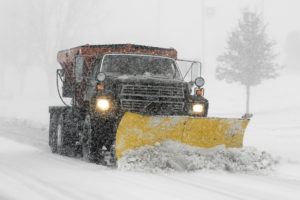 A truck with a snow blade clears a road on Sheppard Air Force Base, Texas, Dec. 24 after a blizzard blew through North Texas. Some places in the region received 10-15 inches of snow and ice. (U.S. Air Force photo/Harry Tonemah)